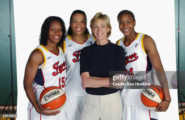 Nikki McCray, Natalie Williams, Head coach Nell Fortner and Tamika Catchings of the Indiana Fever during the Fever Media Day portrait shoot on May 6,...