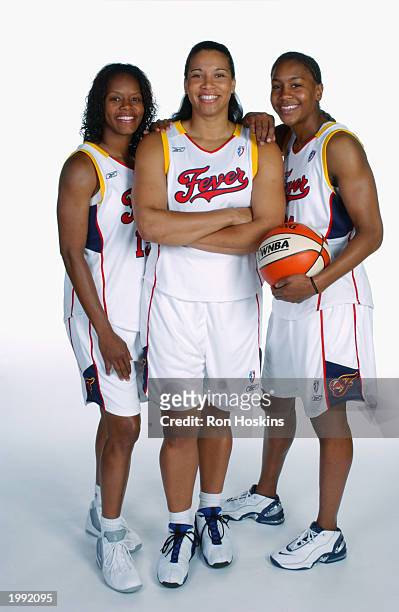 Nikki McCray, Natalie Williams and Tamika Catchings of the Indiana Fever during the Fever Media Day portrait shoot on May 6, 2003 in Indianapolis,...