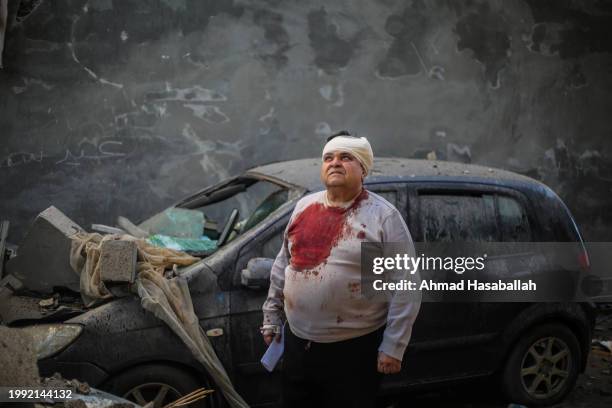 People inspect damage caused to their homes following Israeli air strikes, on February 07, 2024 in Rafah, Gaza. Whilst a new ceasefire deal is...