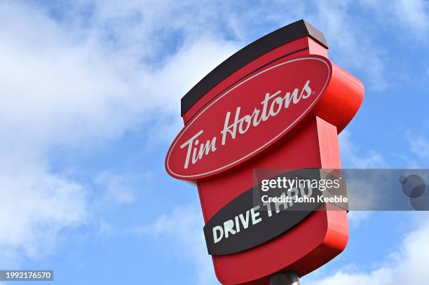 General view of a Tim Hortons Drive-Thru coffeehouse and restaurant sign at Lakeside Retail Park on February 5, 2024 in Grays, United Kingdom.