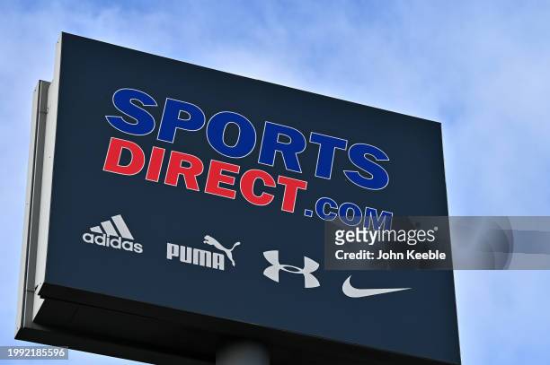 General view of signage for a Sports Direct, sports clothing, footwear and equipment retail store along with adidas, Puma, Under Armour and Nike...