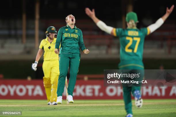 Eliz-Mari Marx of South Africa celebrates with team mates after taking the wicket of Ashleigh Gardner of Australia during game two of the Women's One...