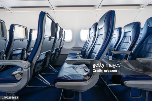 empty airplane seats - plane seat stockfoto's en -beelden