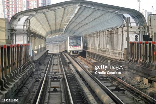 Subway train runs on Line 5 in Beijing, capital of China, Feb 6, 2024.