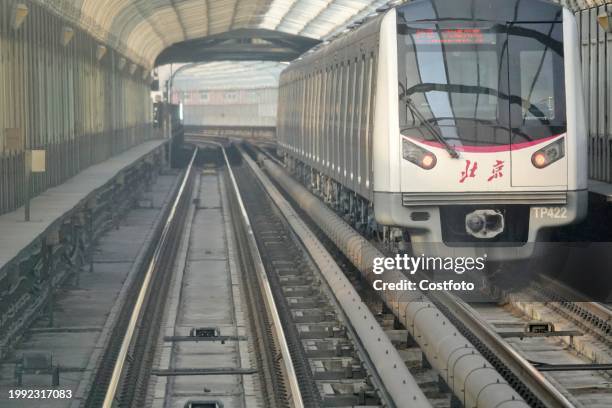 Subway train runs on Line 5 in Beijing, capital of China, Feb 6, 2024.