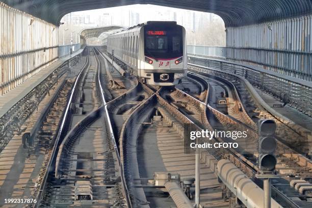 Subway train runs on Line 5 in Beijing, capital of China, Feb 6, 2024.