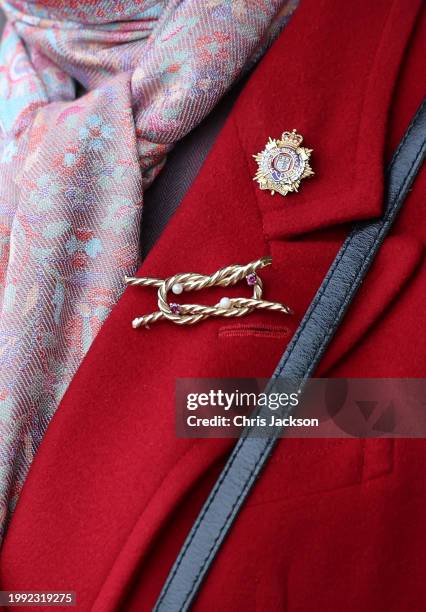 Brooch and the Royal Logistics Corps pin badge worn by Princess Anne, Princess Royal during her visit to the Defence Explosive Ordnance Disposal...