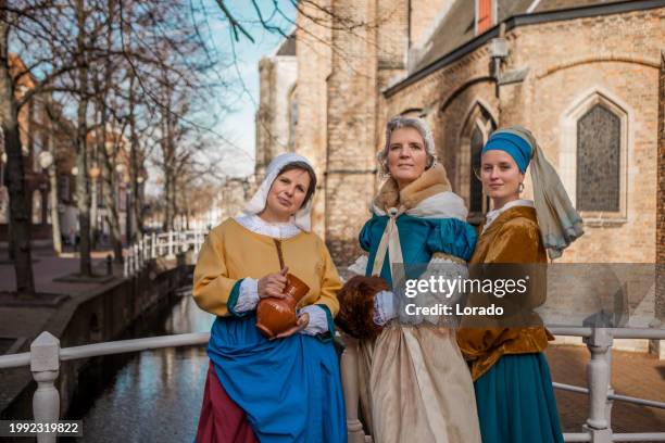 a group of traditional tourist guides in delft - 17th century style stock pictures, royalty-free photos & images