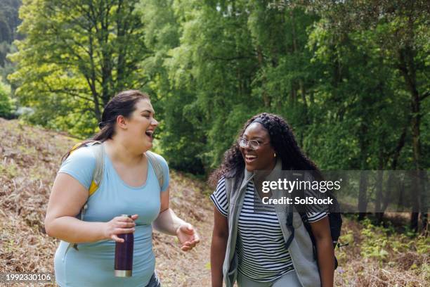 friends enjoying a hike together - springtime exercise stock pictures, royalty-free photos & images