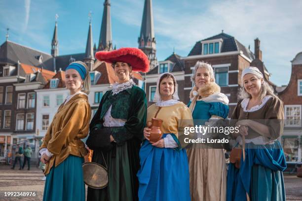 a group of traditional tourist guides in delft - 17th century style stock pictures, royalty-free photos & images