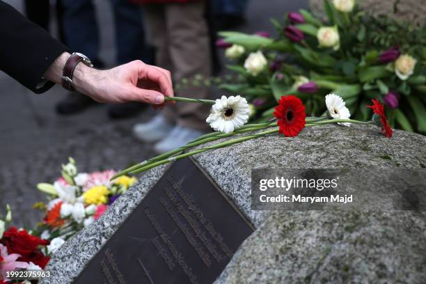 People pay their respects at the memorial for "honour-killing" victim Hatun Surucu on the 19th anniversary of her death on February 07, 2024 in...