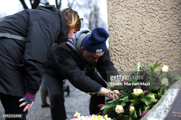 People pay their respects at the memorial for "honour-killing" victim Hatun Surucu on the 19th anniversary of her death on February 07, 2024 in...