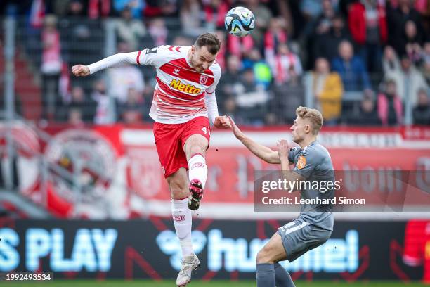 Florian Ballas of Regensburg in action against Cedric Harenbrock of Essen during the 3. Liga match between Jahn Regensburg and Rot-Weiss Essen at...