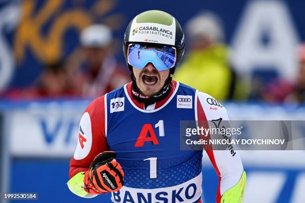 Austria's Manuel Feller celebrates after he competes in the Men's Giant Slalom event during the FIS Alpine Ski World Cup in Bansko, on February 10,...