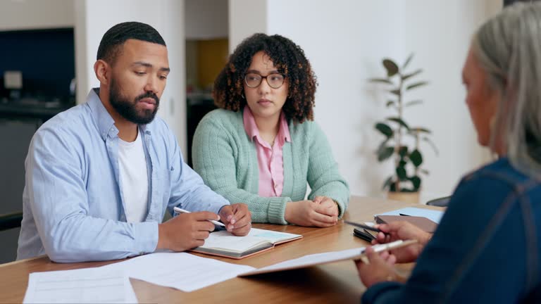https://media.gettyimages.com/id/1992546538/video/couple-discussion-and-documents-or-lawyer-in-home-for-real-estate-investment-life-insurance.jpg?b=1&s=640x640&k=20&c=Q3S3e8KwEBBsI_cE12aeqkrjXjLEyvzG9DxkcyDKd0Q=