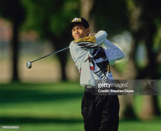 Tiger Woods from the United States follows his drive off the fairway during the Nissan Los Angeles Open golf tournament on 26th February 1993 at the...