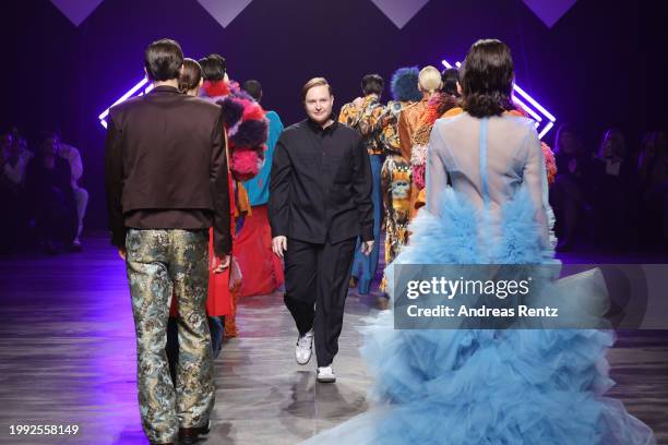 Designer Danny Reinke greets the audience on the runway during the Danny Reinke Runway Show as part of the W.E4. Fashion Day during Berlin Fashion...