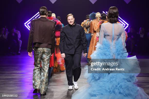 Designer Danny Reinke greets the audience on the runway during the Danny Reinke Runway Show as part of the W.E4. Fashion Day during Berlin Fashion...