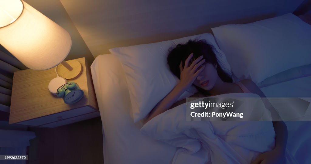 Asian woman sleepless at night
