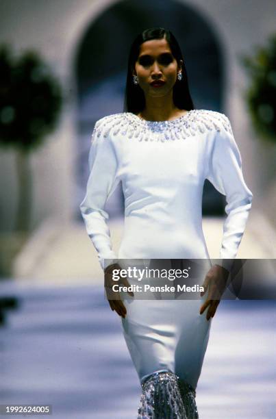 Model Anna Bayle walks in the Chanel Spring 1986 Couture Runway Show on January 28 in Paris, France.