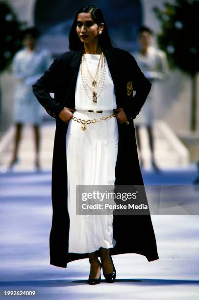Model Anna Bayle walks in the Chanel Spring 1986 Couture Runway Show on January 28 in Paris, France.