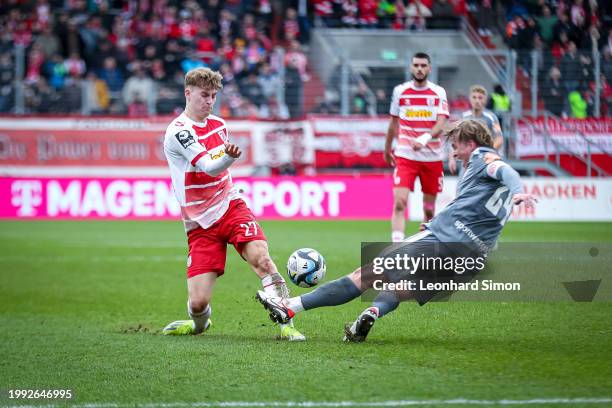 Dominik Kother of Regensburg in action against Felix Götze of Essen during the 3. Liga match between Jahn Regensburg and Rot-Weiss Essen at...