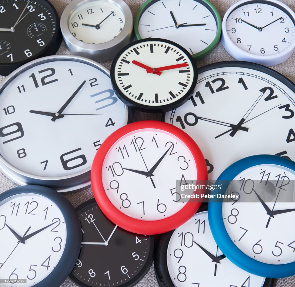 Many Clocks Ringing Selection Of Wall Clocks Displaying The Same Time High-Res Stock Photo ...