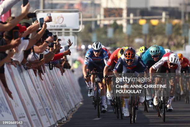Australia's Caleb Ewan of Jayco Alula crosses the finish line in front of France's Bryan Coquard of Cofidis , to win the first stage of the Tour of...