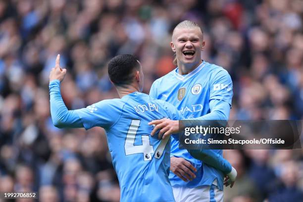 Erling Haaland of Manchester City celebrates with Phil Foden of Manchester City after scoring their 1st goal during the Premier League match between...