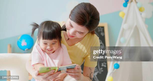 asian mother accompany child study - accompanying stock pictures, royalty-free photos & images