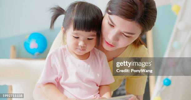 asian mother accompany child study - accompanying stock pictures, royalty-free photos & images