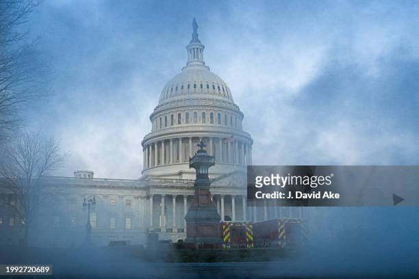 Steam rising from the heating system vents surrounds the US Capitol Dome on a chilling morning in the Nations Capital on February 7 in Washington, DC.
