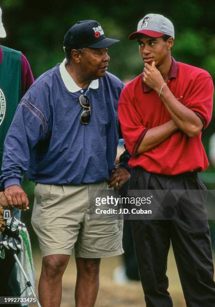 Tiger Woods from the United States in conversation with his father Earl Woods during the United States Amateur Championship golf tournament on 27th...