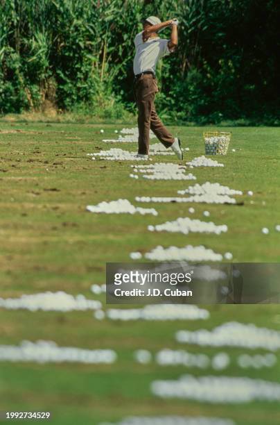 Tiger Woods from the United States practicing his golf swing technique during practice for the United States Amateur Championship golf tournament on...