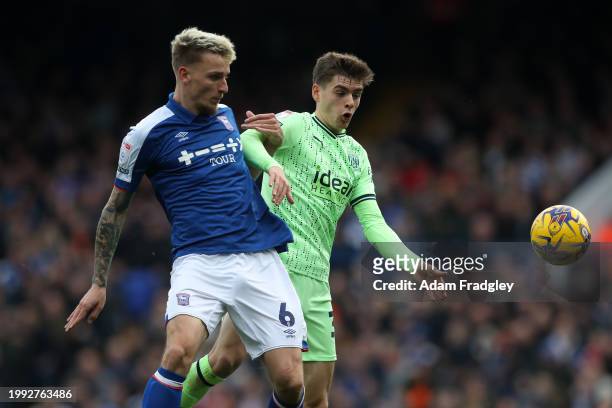 Luke Woolfenden of Ipswich Town and Tom Fellows of West Bromwich Albion during the Sky Bet Championship match between Ipswich Town and West Bromwich...