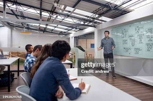 It Lessons Teacher Giving An It Lesson And Explaining A User Experience Diagram On ...