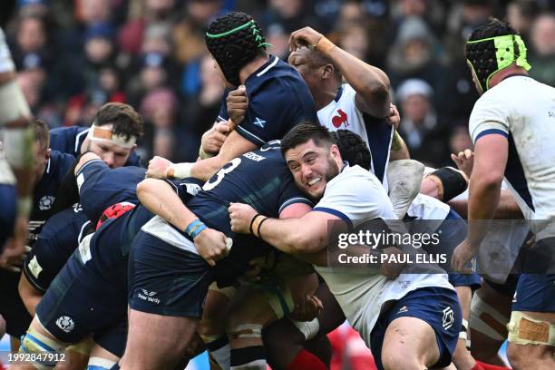 Players compete for the ball in the maul during the Six Nations international rugby union match between Scotland and France at Murrayfield Stadium in...