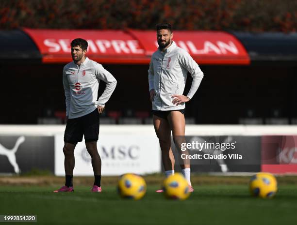 Christian Pulisic and Olivier Giroud of AC Milan look on during a AC Milan training session at Milanello on February 07, 2024 in Cairate, Italy.