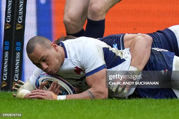 France's centre Gael Fickou scores France's first try during the Six Nations international rugby union match between Scotland and France at...