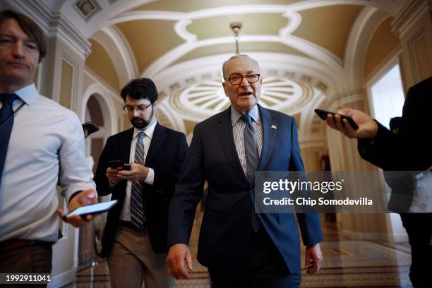 Senate Majority Leader Charles Schumer talks to reporters as he walks to his office at the U.S. Capitol on February 07, 2024 in Washington, DC. In...