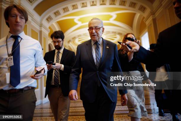 Senate Majority Leader Charles Schumer talks to reporters as he walks to his office at the U.S. Capitol on February 07, 2024 in Washington, DC. In...