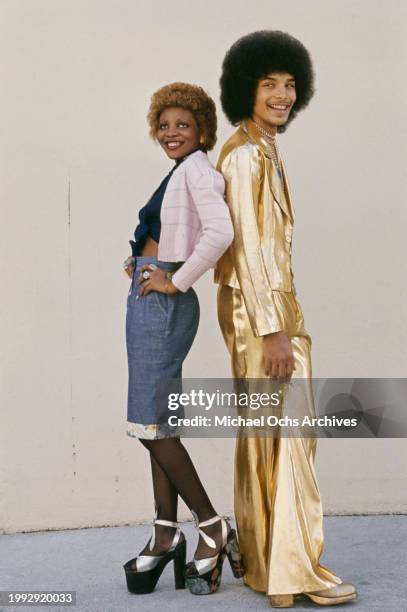 Soul Train dancers pose back to back for a photoshoot, United States, circa 1970s.