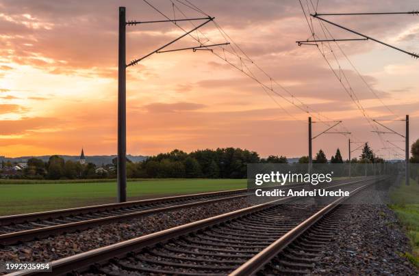 sunrise landscape with railroad tracks in a german village - stuttgart village stock pictures, royalty-free photos & images