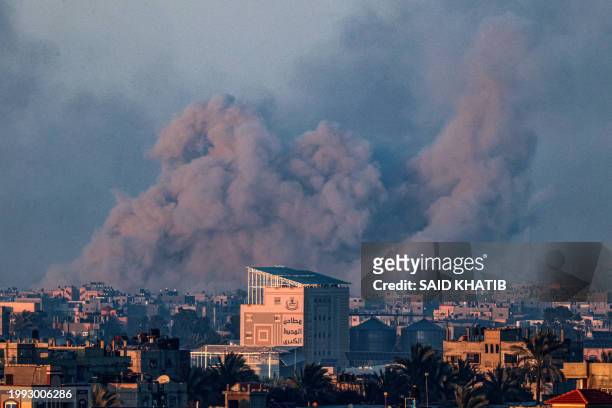 Picture taken from Rafah shows smoke billowing during Israeli bombardment over Khan Yunis in the southern Gaza Strip on February 10 amid the ongoing...