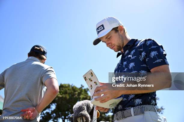 Rasmus Neergaard-Petersen from Denmark with his yardage book during day three of the Bain's Whisky Cape Town Open at Royal Cape Golf Club on February...