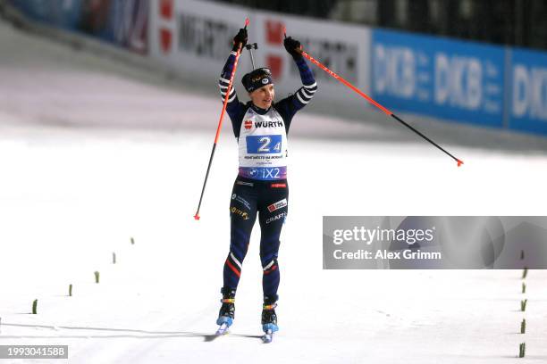 Julia Simon of Team France reacts as she crosses the line as her team celebrates victory in the Mixed Relay of the IBU World Championships Biathlon...