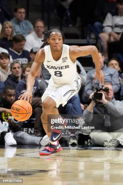 Quincy Olivari of the Xavier Musketeers dribbles up court during a college basketball game against the St. John's Red Storm at the Cintas Center on...