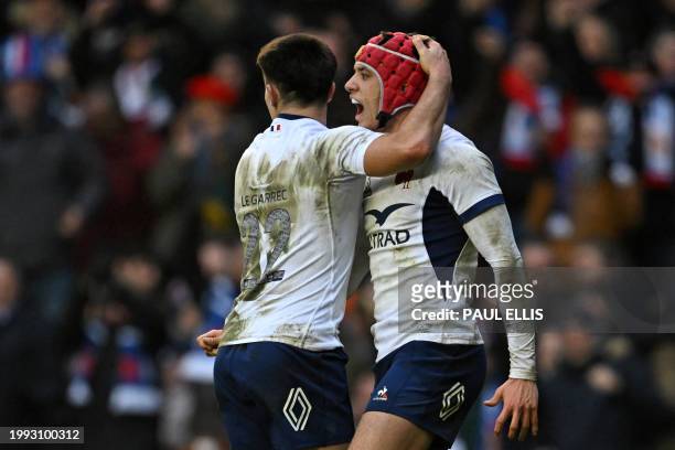 France's wing Louis Bielle-Biarrey celebrates with France's Nolann Le Garrec after scoring a try during the Six Nations international rugby union...