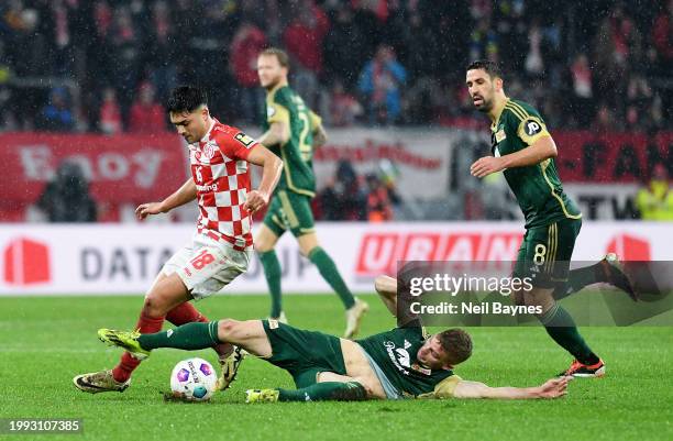 Nadiem Amiri of 1.FSV Mainz 05 is challenged by Andras Schaefer of 1.FC Union Berlin during the Bundesliga match between 1. FSV Mainz 05 and 1. FC...