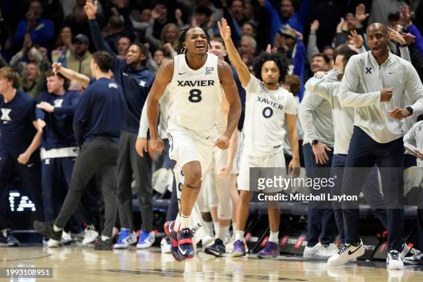 Quincy Olivari of the Xavier Musketeers celebrates a shot during a college basketball game against the St. John's Red Storm at the Cintas Center on...
